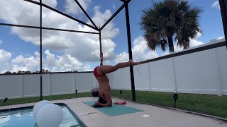 Sexy neighbor yoga instructor stretching by pool