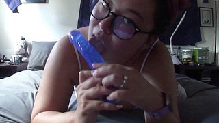 Nerdy Asian teen playing with toys