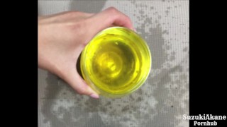 A girl who pees beautifully in a glass