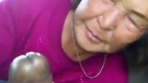 ”Asian Old Woman Sucks Ebony Meat In The Car”